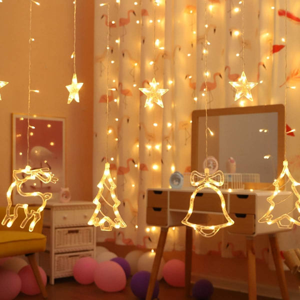 XERGY Christmas LED Curtain Lights, 138 LEDs Star Jingle Bell Elk Xmas Tree Window Lights 8 Mode Plug in Fairy Curtain String Lights for Home Bedroom Wedding Party Decoration, Warm White